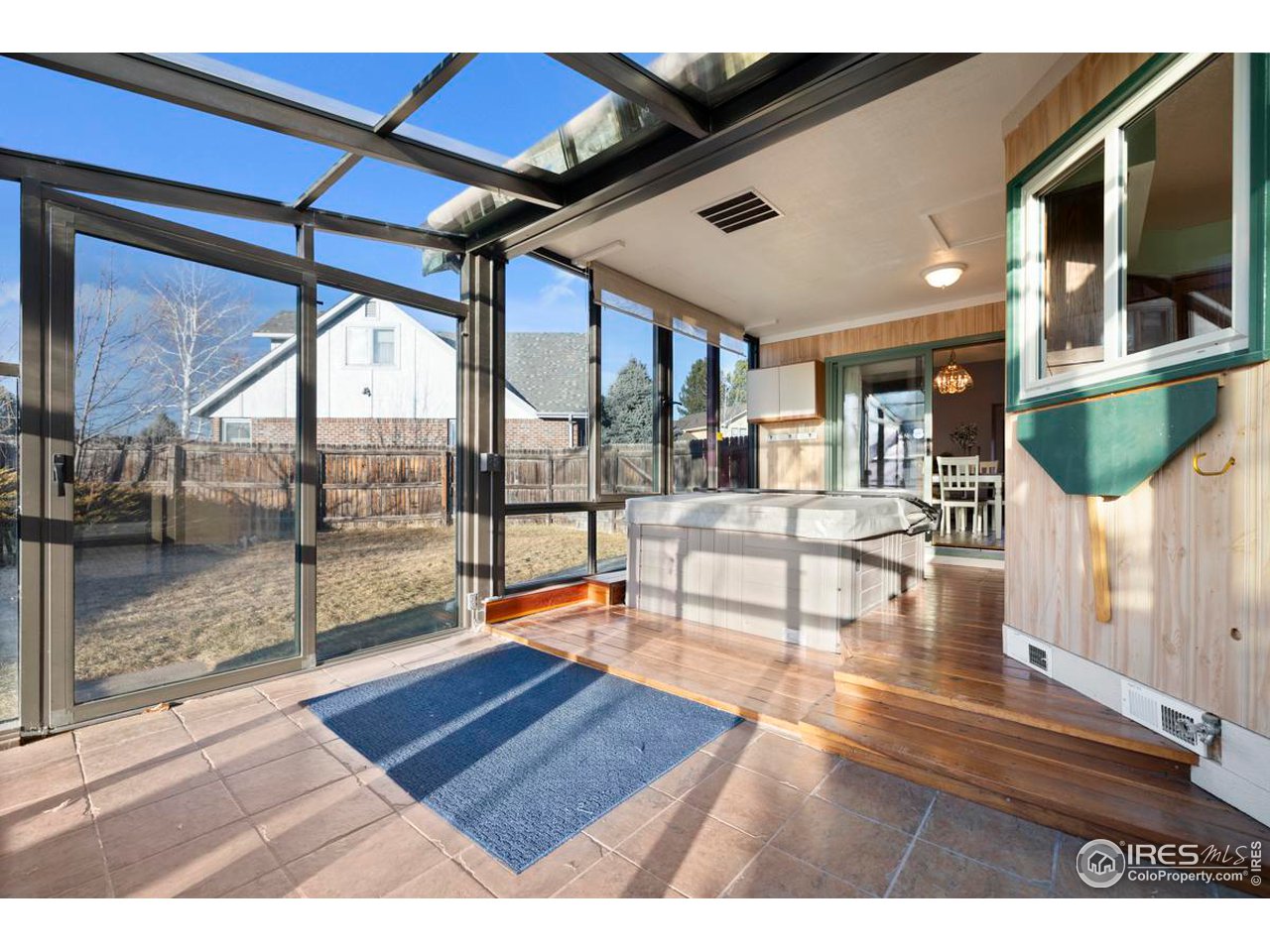 2713 Beech Way Longmont, CO 80503 - Photo 10 of 36 a living room filled with furniture and a flat screen tv