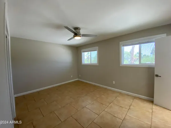 a view of an empty room with windows