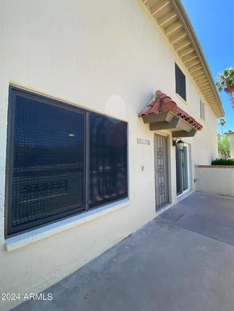 a view of a house with a garage and a sink