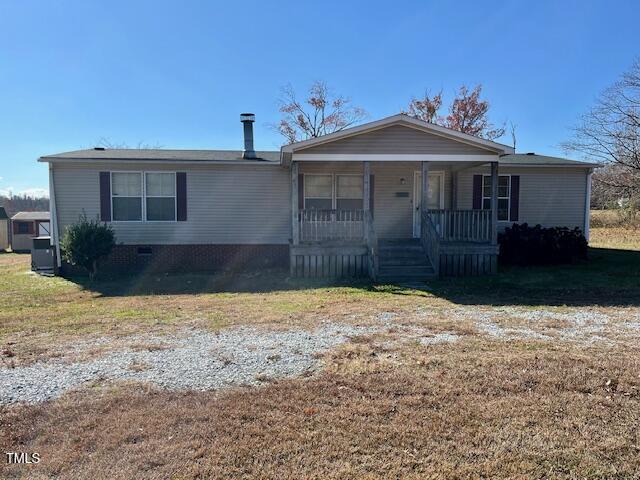 210 Holloway Road Roxboro, NC 27573 - Photo 2 of 15 a front view of a house with a yard