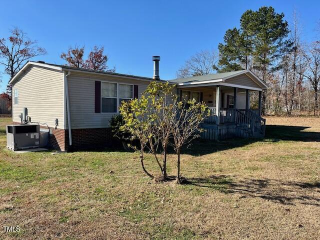 210 Holloway Road Roxboro, NC 27573 - Photo 3 of 15 a front view of a house with garden
