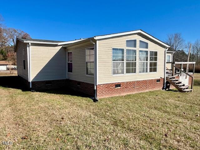 210 Holloway Road Roxboro, NC 27573 - Photo 4 of 15 a front view of a house with a yard