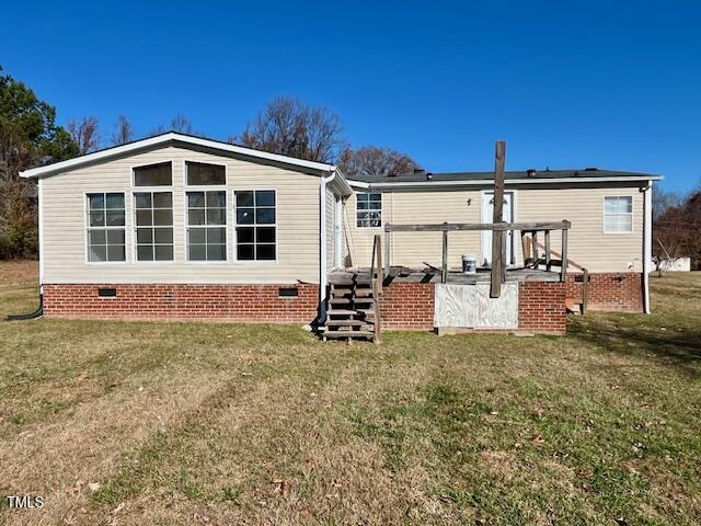 210 Holloway Road Roxboro, NC 27573 - Photo 5 of 15 a view of a house with backyard and sitting area