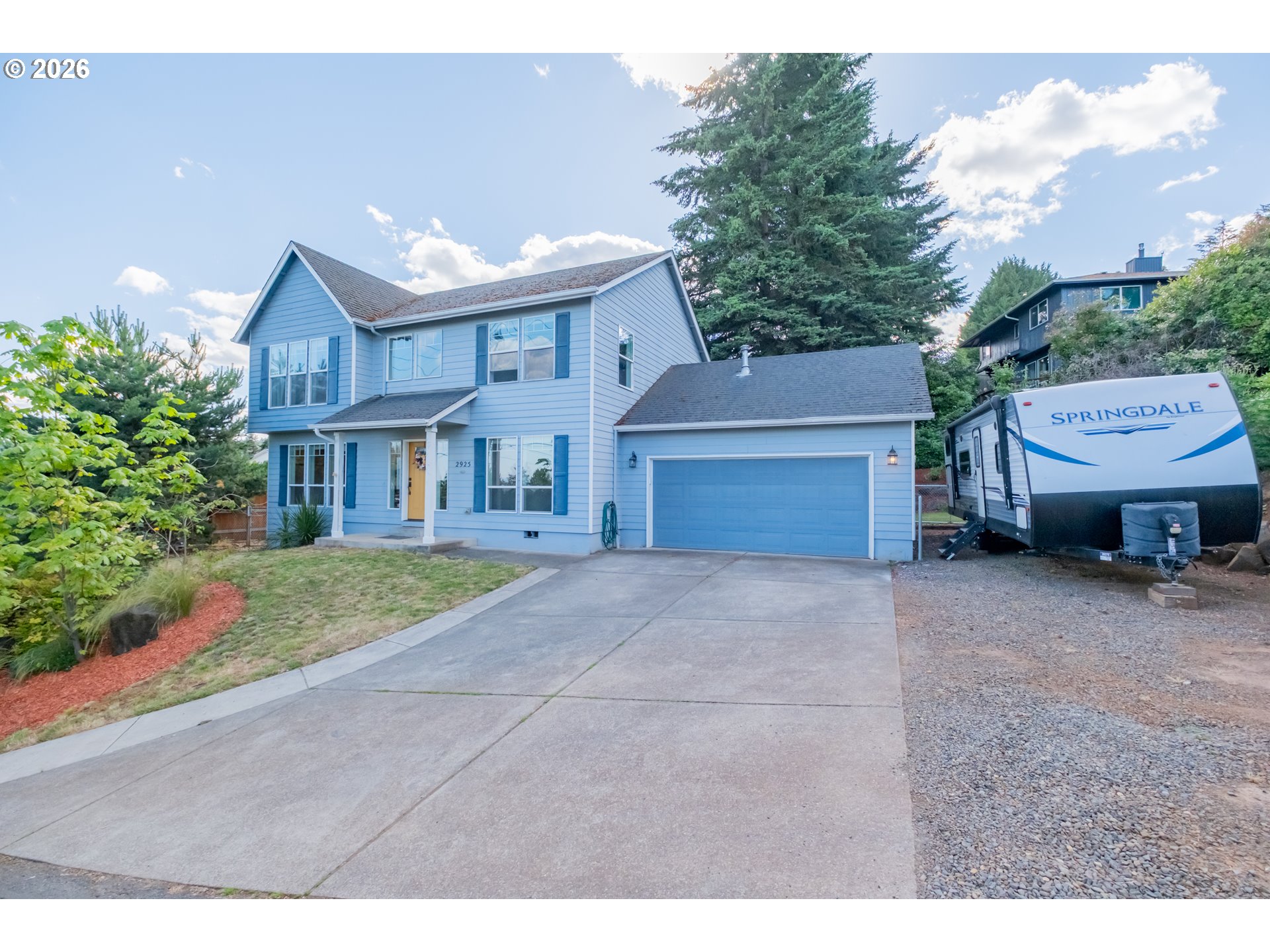 2925 Doaks Ferry Road Northwest Salem, OR 97304 - Photo 3 of 47 a front view of a house with a yard and garage