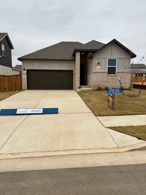 a front view of a house with garage