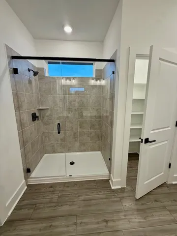 a bathroom with a bathtub and a shower