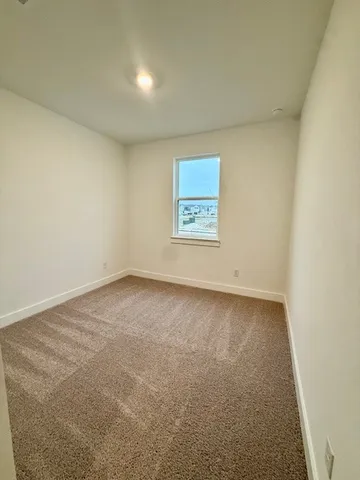 an empty room with a empty space and window
