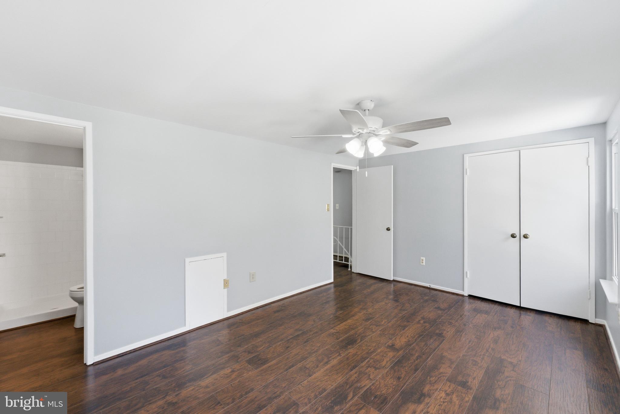 14629 Sandy Ridge Road Silver Spring, MD 20905 - Photo 19 of 47 a view of an empty room with wooden floor