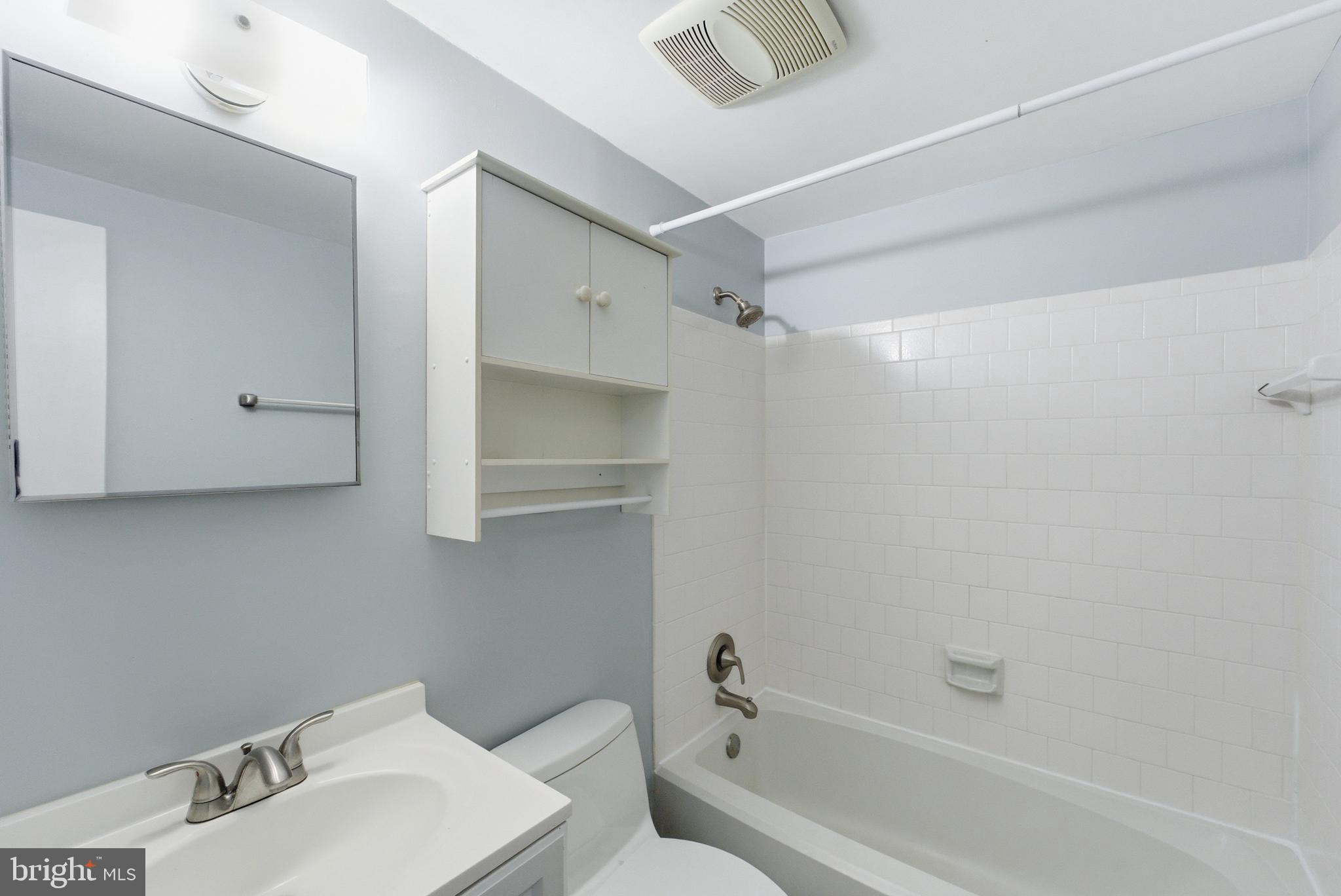 14629 Sandy Ridge Road Silver Spring, MD 20905 - Photo 27 of 47 a bathroom with a bathtub a sink and toilet