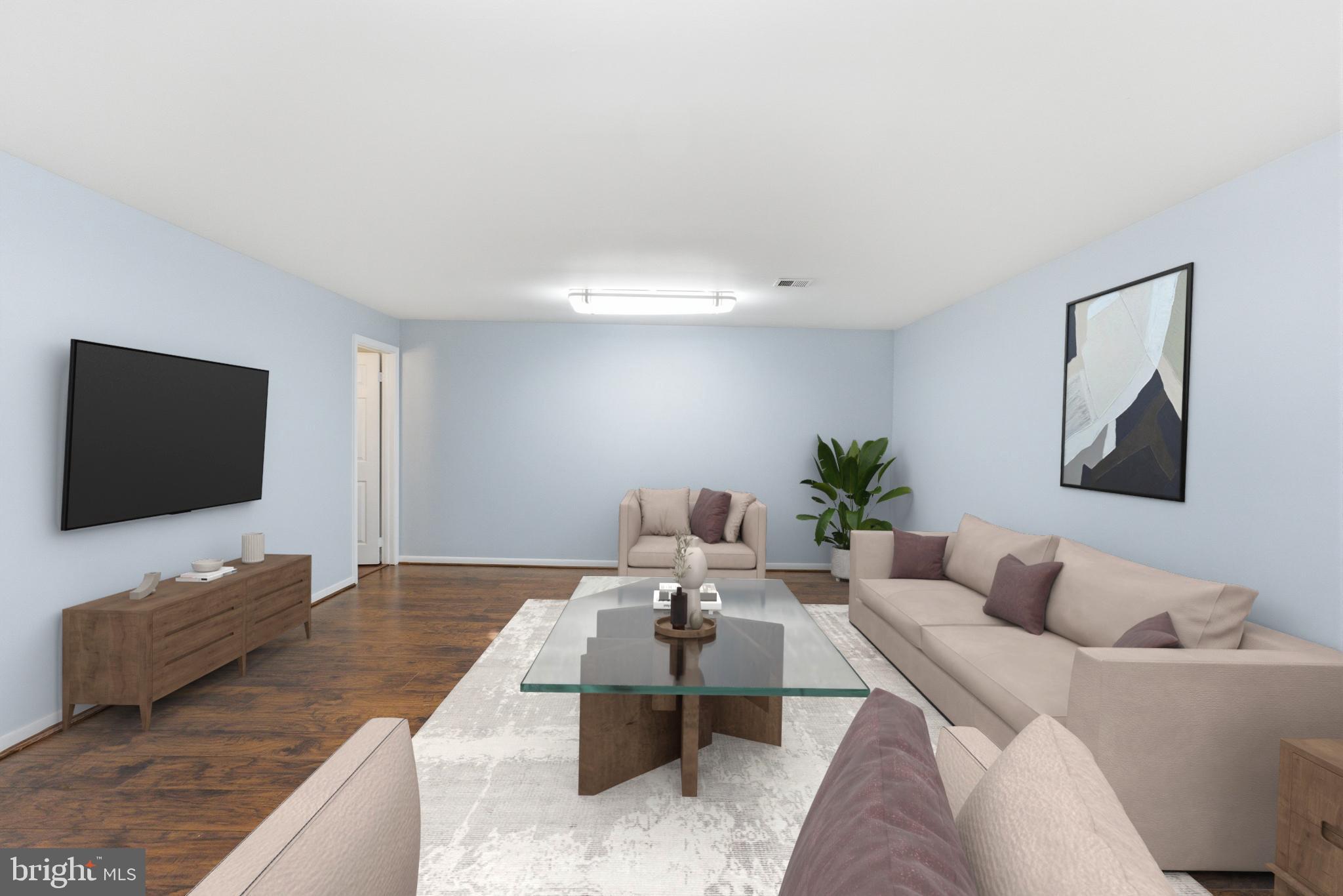 14629 Sandy Ridge Road Silver Spring, MD 20905 - Photo 29 of 47 a living room with furniture and a flat screen tv