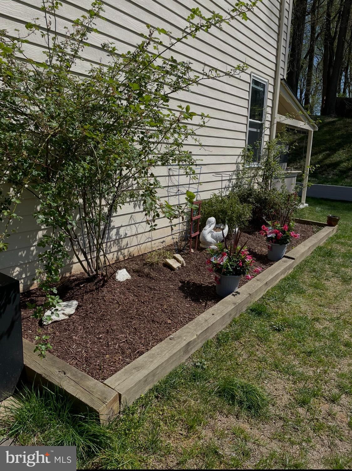 14629 Sandy Ridge Road Silver Spring, MD 20905 - Photo 43 of 47 a view of a backyard with sitting area