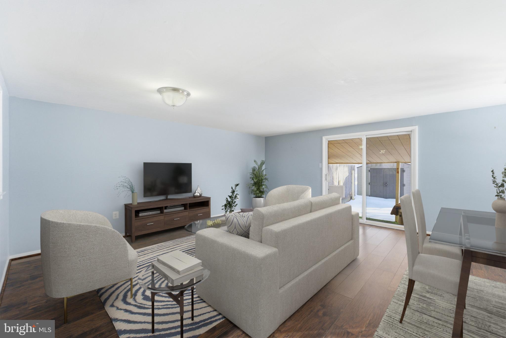 14629 Sandy Ridge Road Silver Spring, MD 20905 - Photo 10 of 47 a living room with furniture and a flat screen tv