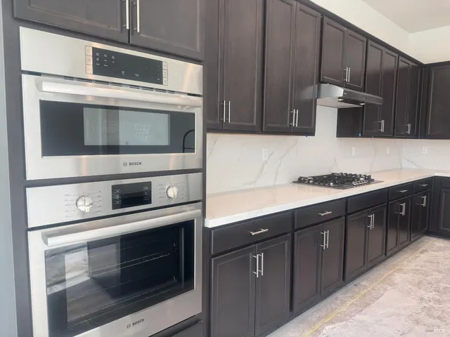 a bathroom with a sink and a stove