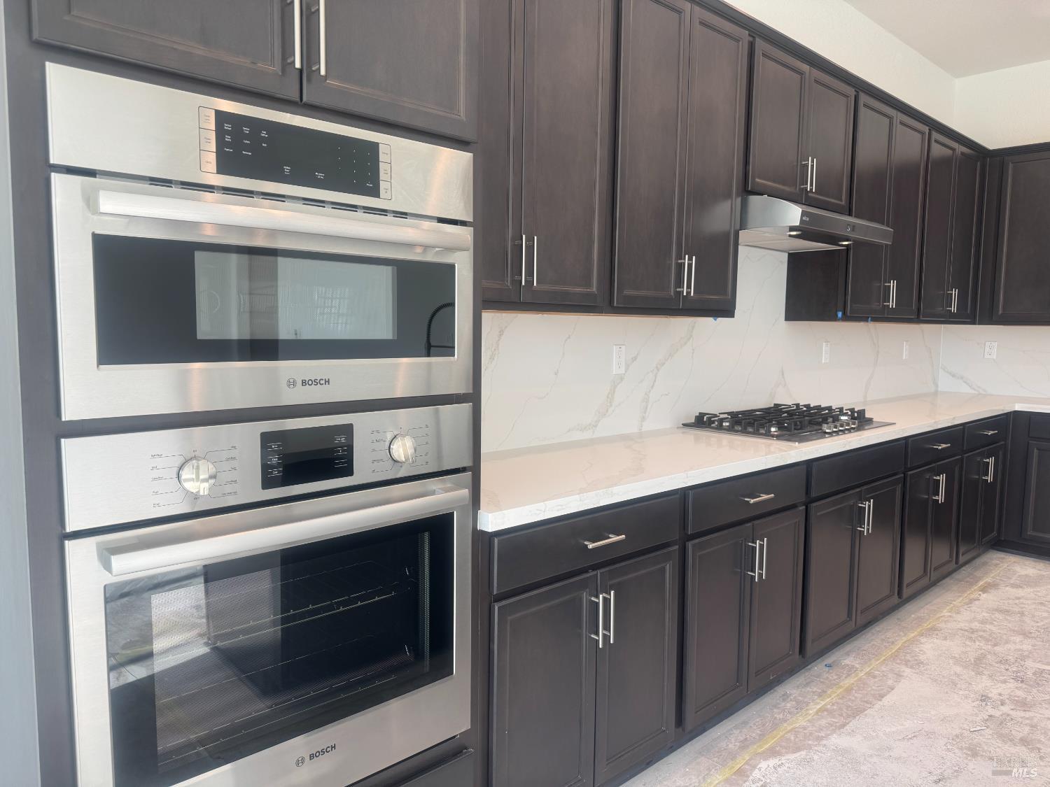 727 Temescal Street Antioch, CA 94561 - Photo 3 of 7 a kitchen with stainless steel appliances kitchen island wooden cabinets and a stove top oven