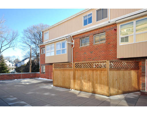 93 C Spring Street, Unit 30 Watertown, MA 02472 - Photo 17 of 20 a view of a brick building with many windows