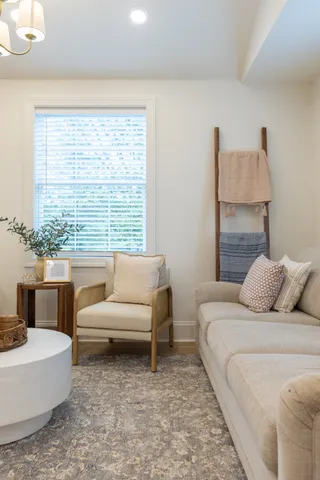 a bedroom with a bed and a couch