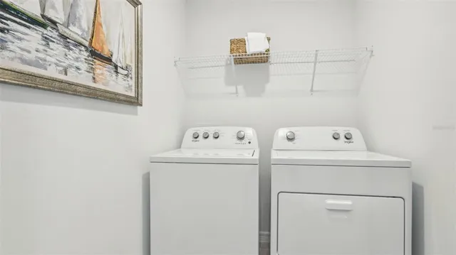 a utility room with dryer and washer