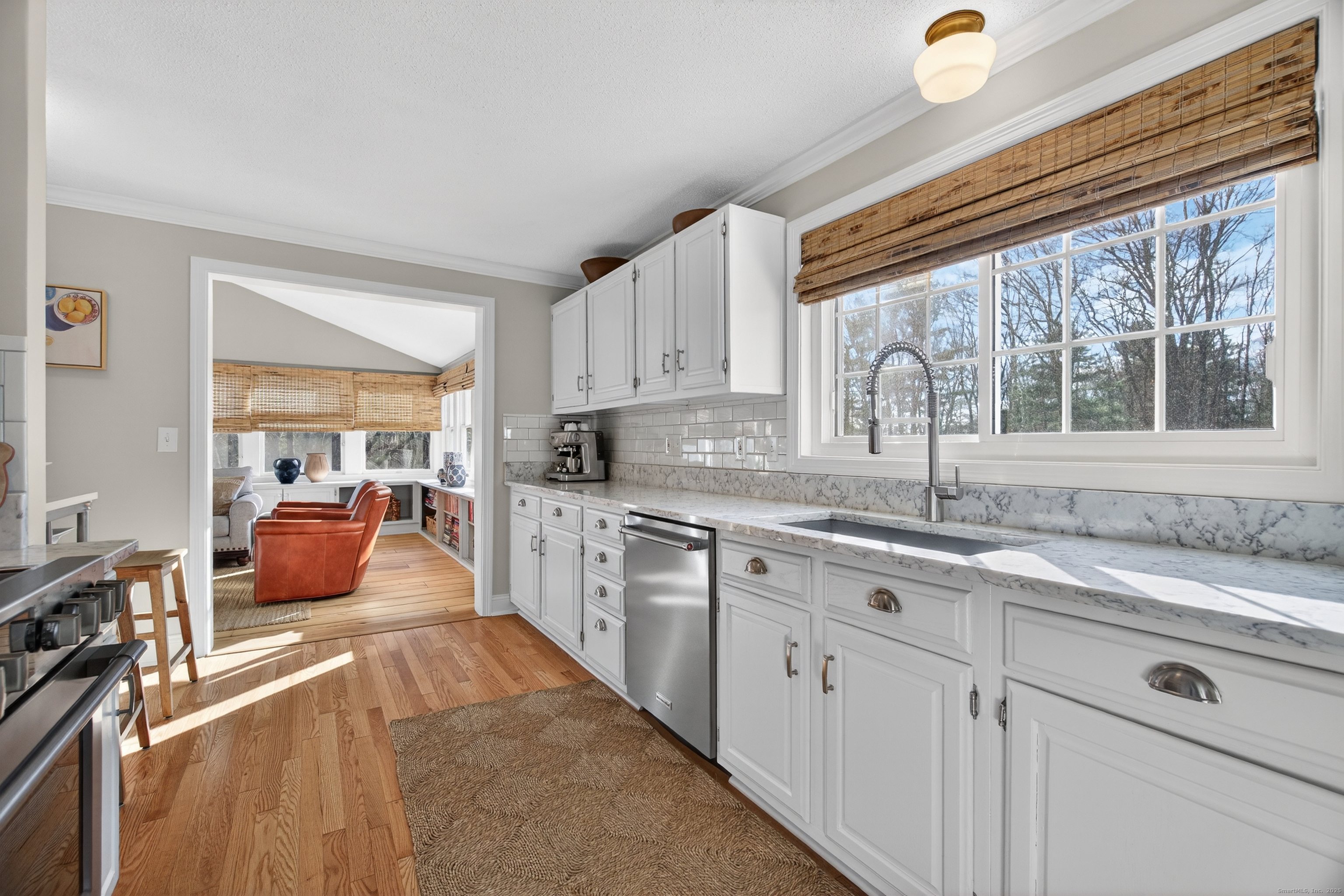 84 Hop Brook Road Simsbury, CT 06070 - Photo 11 of 36 a large kitchen with kitchen island granite countertop a window and a sink