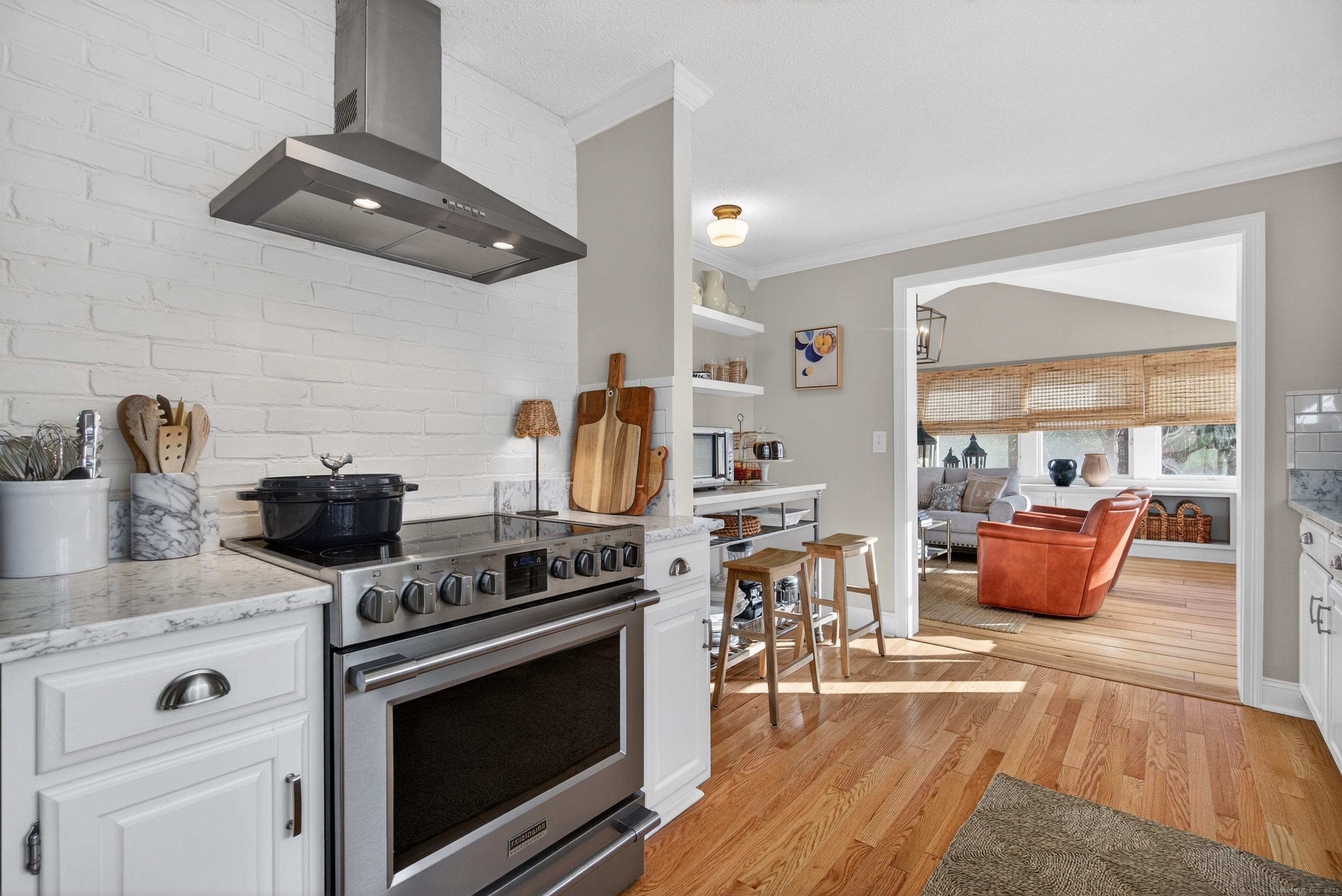 84 Hop Brook Road Simsbury, CT 06070 - Photo 13 of 36 a kitchen with stainless steel appliances granite countertop a stove and a sink