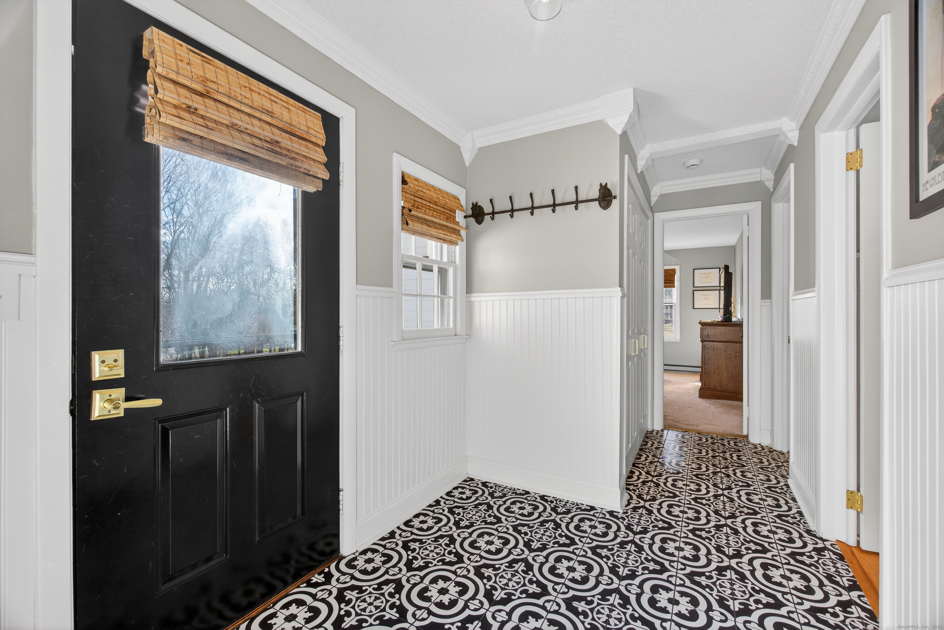 84 Hop Brook Road Simsbury, CT 06070 - Photo 16 of 36 a view of a hallway with wooden floor and windows