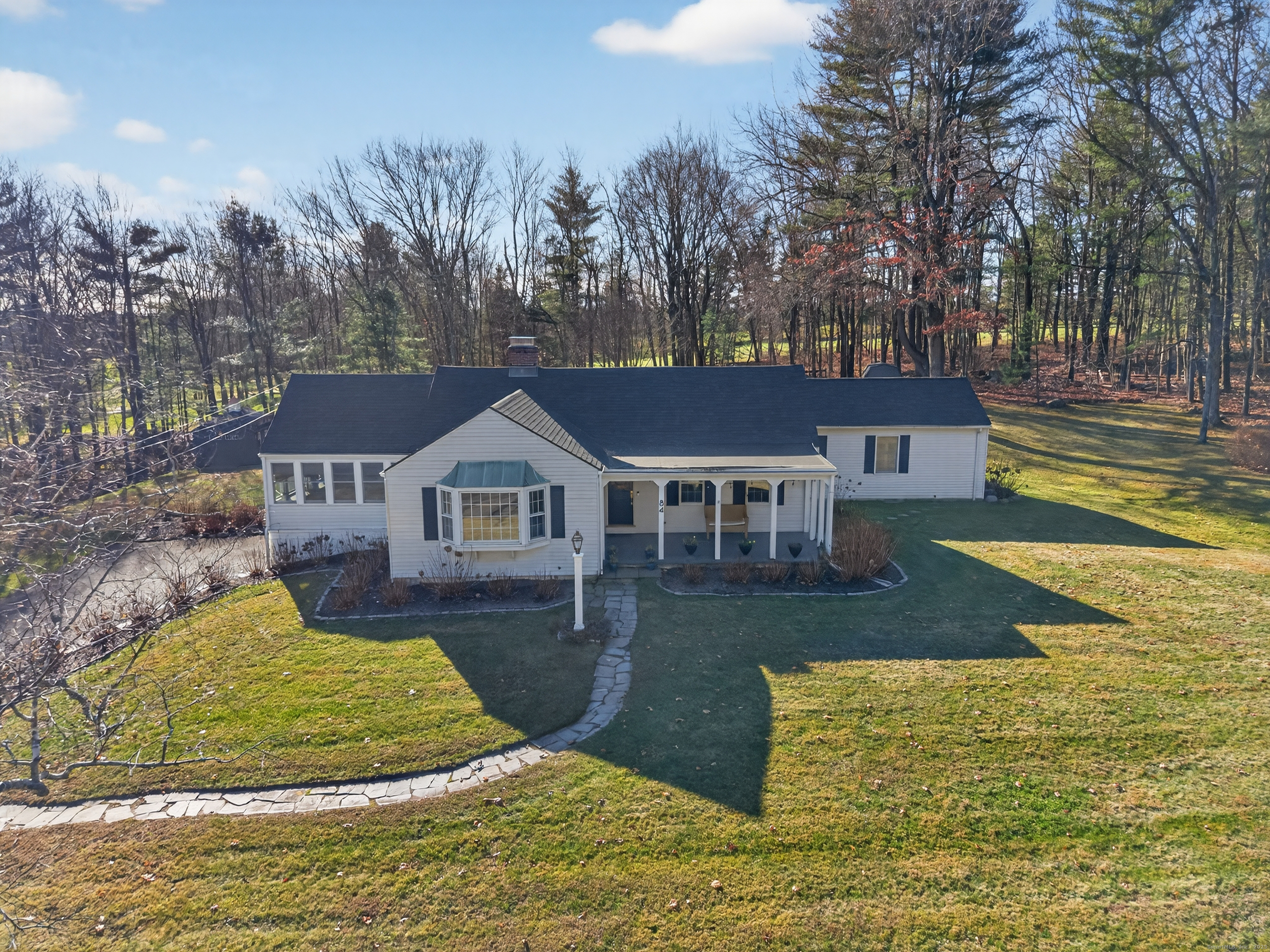 84 Hop Brook Road Simsbury, CT 06070 - Photo 2 of 36 a view of a house with pool and sitting area