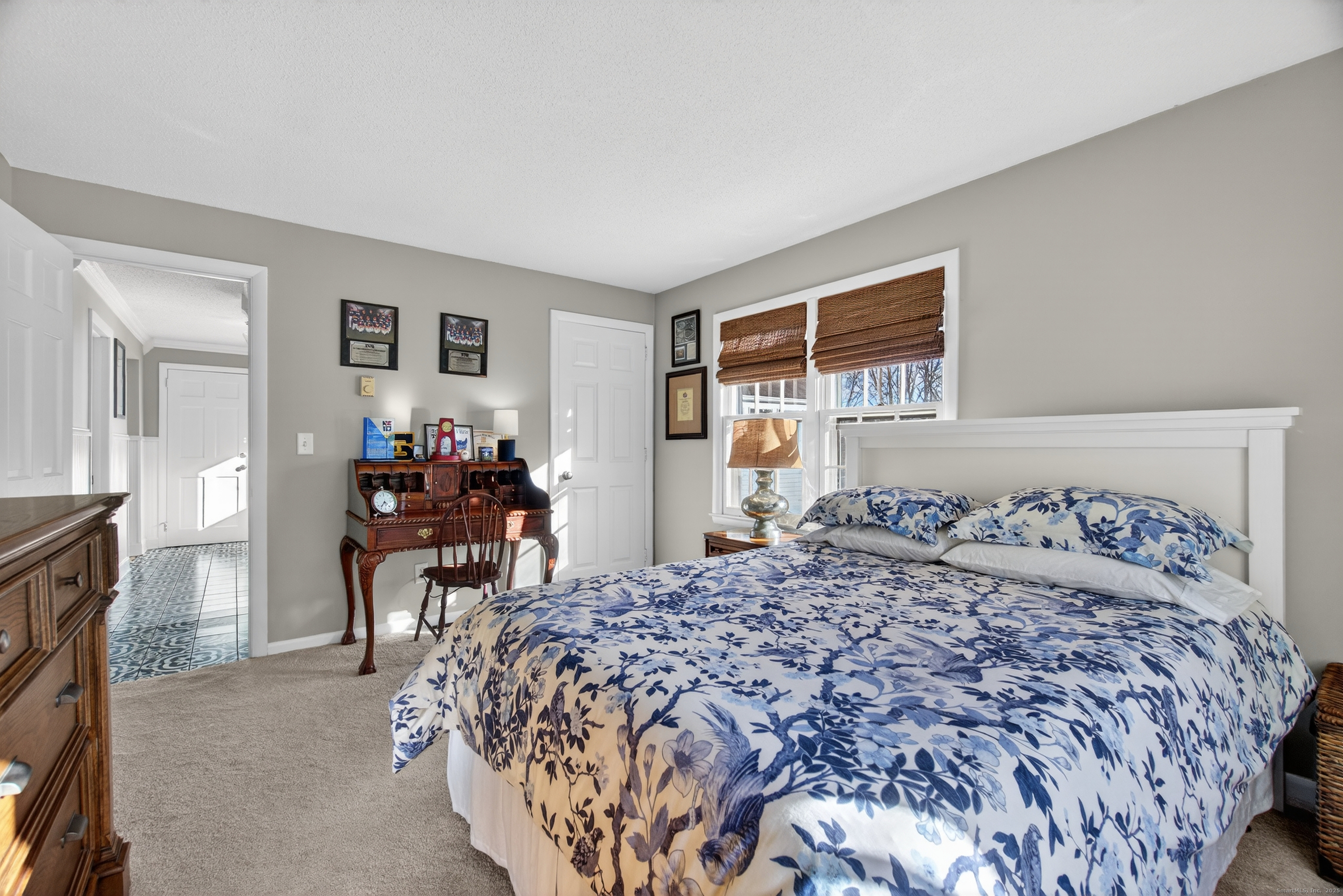 84 Hop Brook Road Simsbury, CT 06070 - Photo 26 of 36 a bedroom with a bed and a table in it