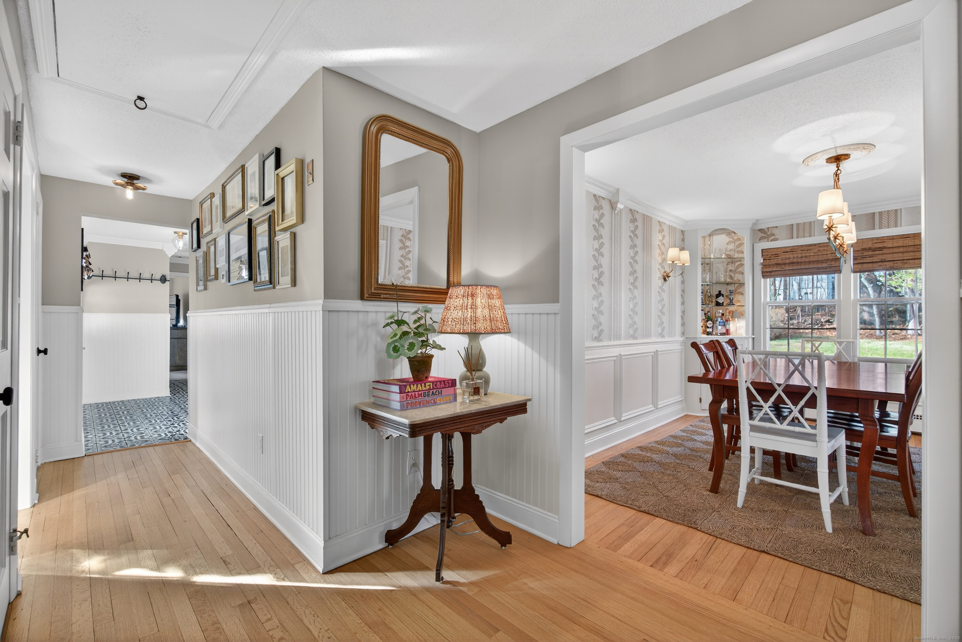 84 Hop Brook Road Simsbury, CT 06070 - Photo 3 of 36 a view of a dining room with furniture and wooden floor