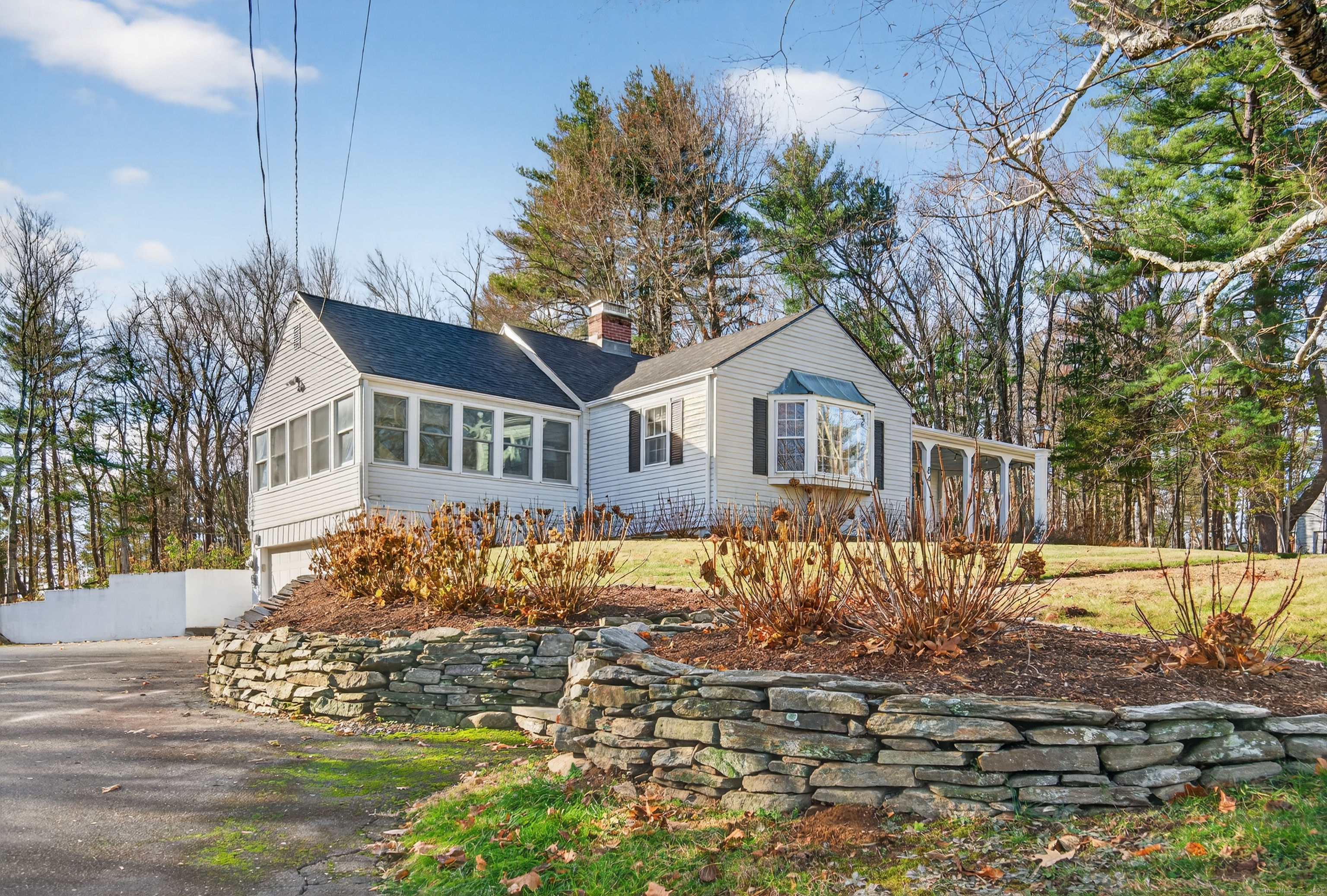 84 Hop Brook Road Simsbury, CT 06070 - Photo 35 of 36 a front view of a house with a yard