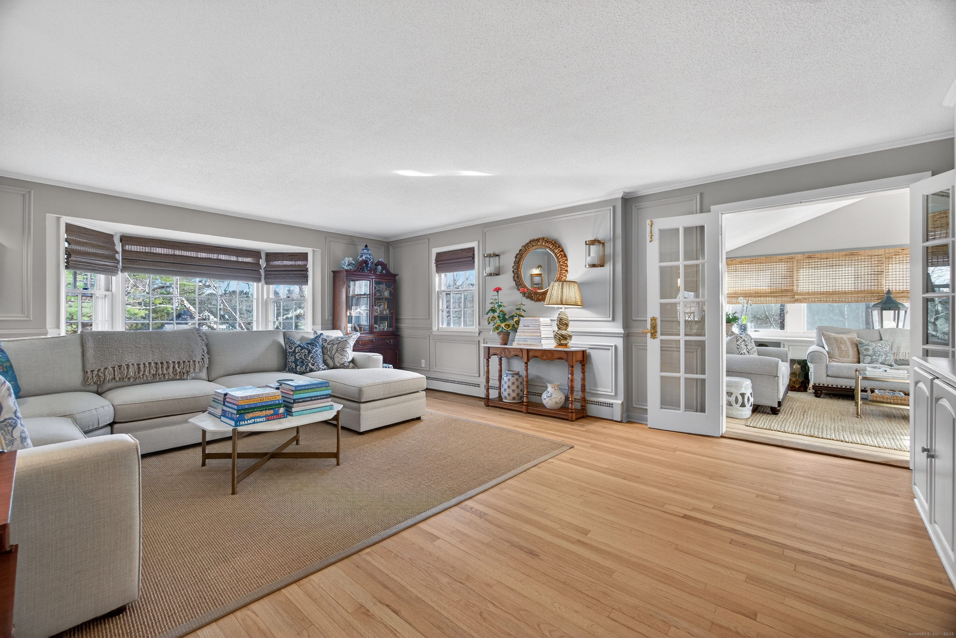 84 Hop Brook Road Simsbury, CT 06070 - Photo 4 of 36 a living room with furniture and a fireplace