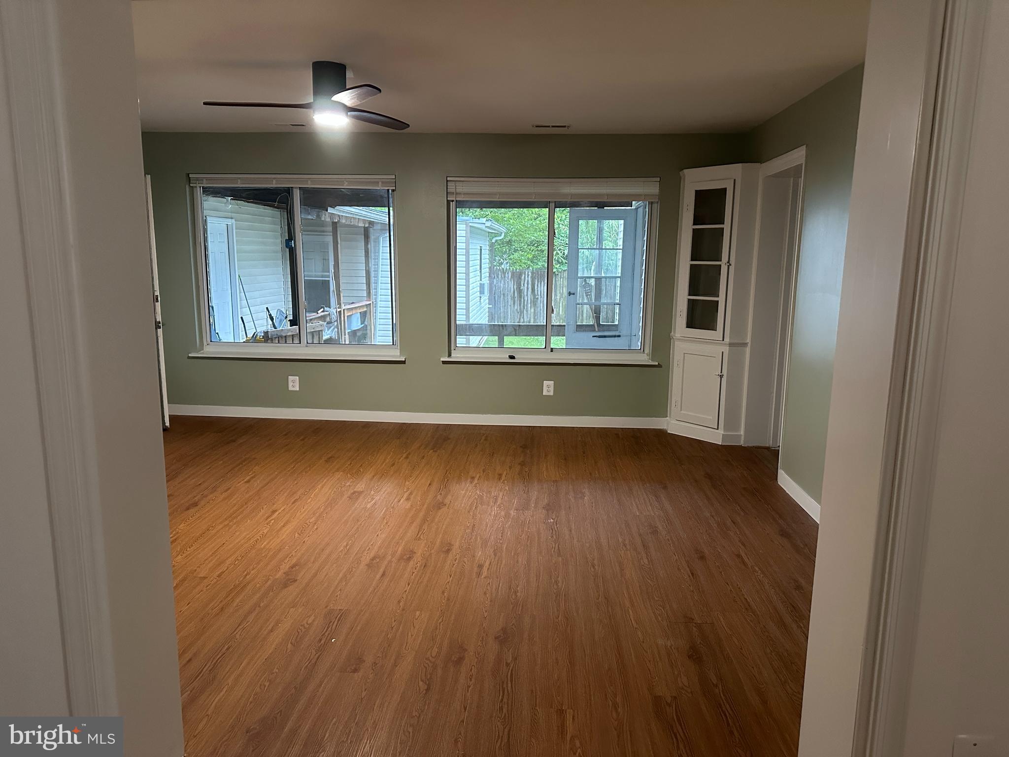 8411 11th Avenue Silver Spring, MD 20903 - Photo 10 of 24 an empty room with wooden floor and windows