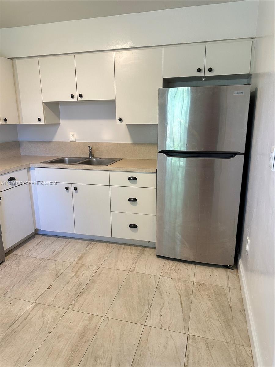 22840 Southwest 155th Avenue, Unit 2 Miami, FL 33170 - Photo 5 of 13 a white refrigerator freezer sitting in a kitchen
