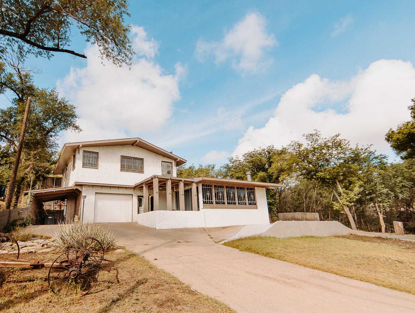 585 Comanche Drive Lubbock, TX 79404 - Photo 13 of 17 a front view of a house with a yard