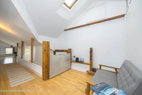 a bedroom with a bed and hallway
