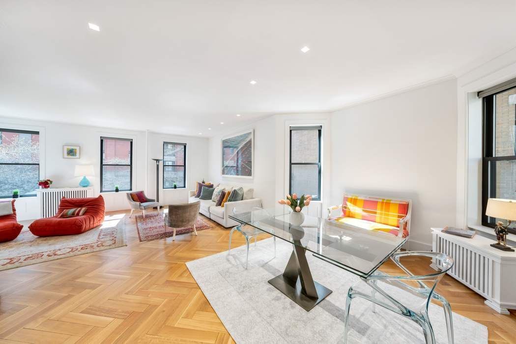 1356 Madison Avenue, Unit 3S Manhattan, NY 10128 - Photo 3 of 16 a living room with furniture and a flat screen tv