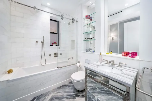 a bathroom with a sink a toilet and a bathtub