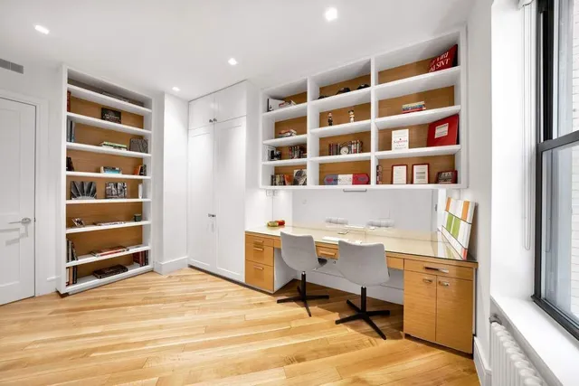 a view of a workspace with furniture and empty room