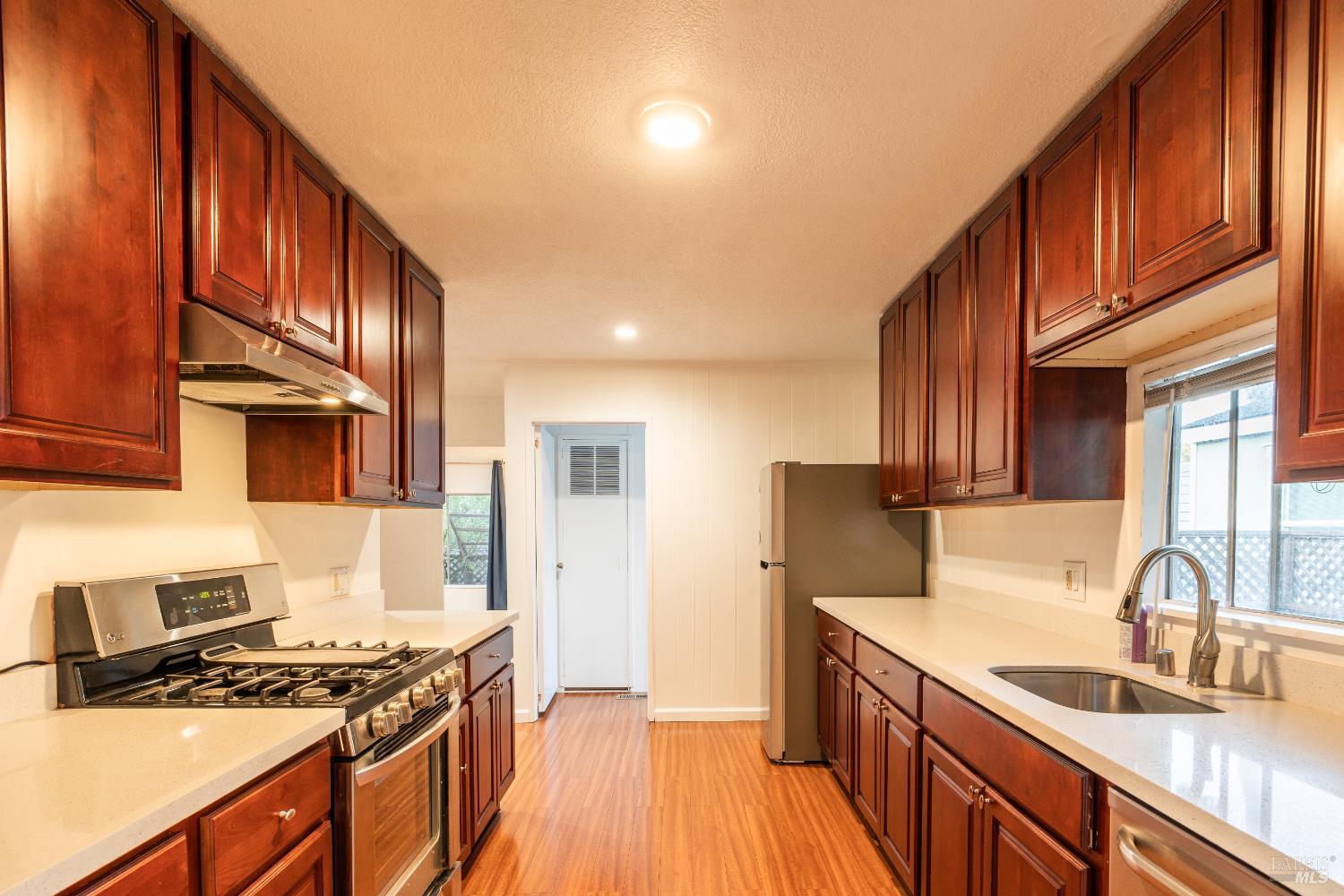 275 Carlsbad Court San Rafael, CA 94903 - Photo 11 of 32 a kitchen with stainless steel appliances granite countertop a sink stove and cabinets