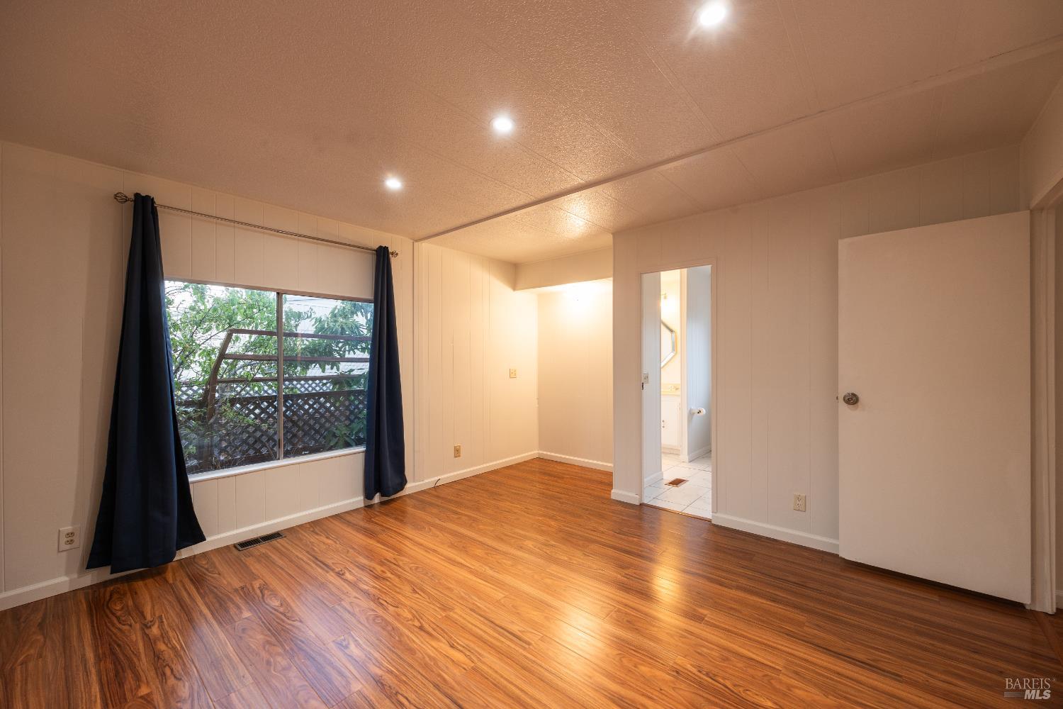 275 Carlsbad Court San Rafael, CA 94903 - Photo 19 of 32 a view of hallway with a large window and wooden floor