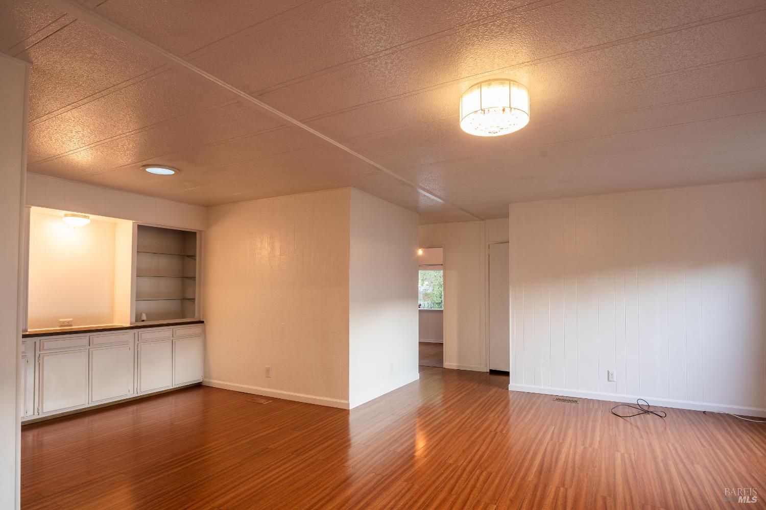 275 Carlsbad Court San Rafael, CA 94903 - Photo 21 of 32 a view of empty room with wooden floor and fan