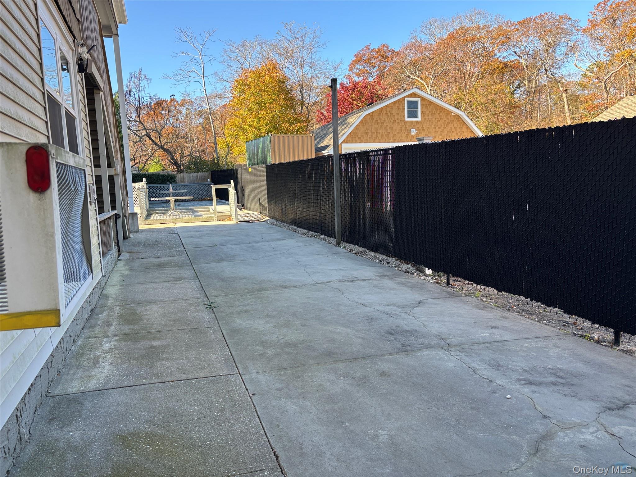 40 Canoe Place Road, Unit 4 Hampton Bays, NY 11946 - Photo 22 of 36 a view of a house with a backyard
