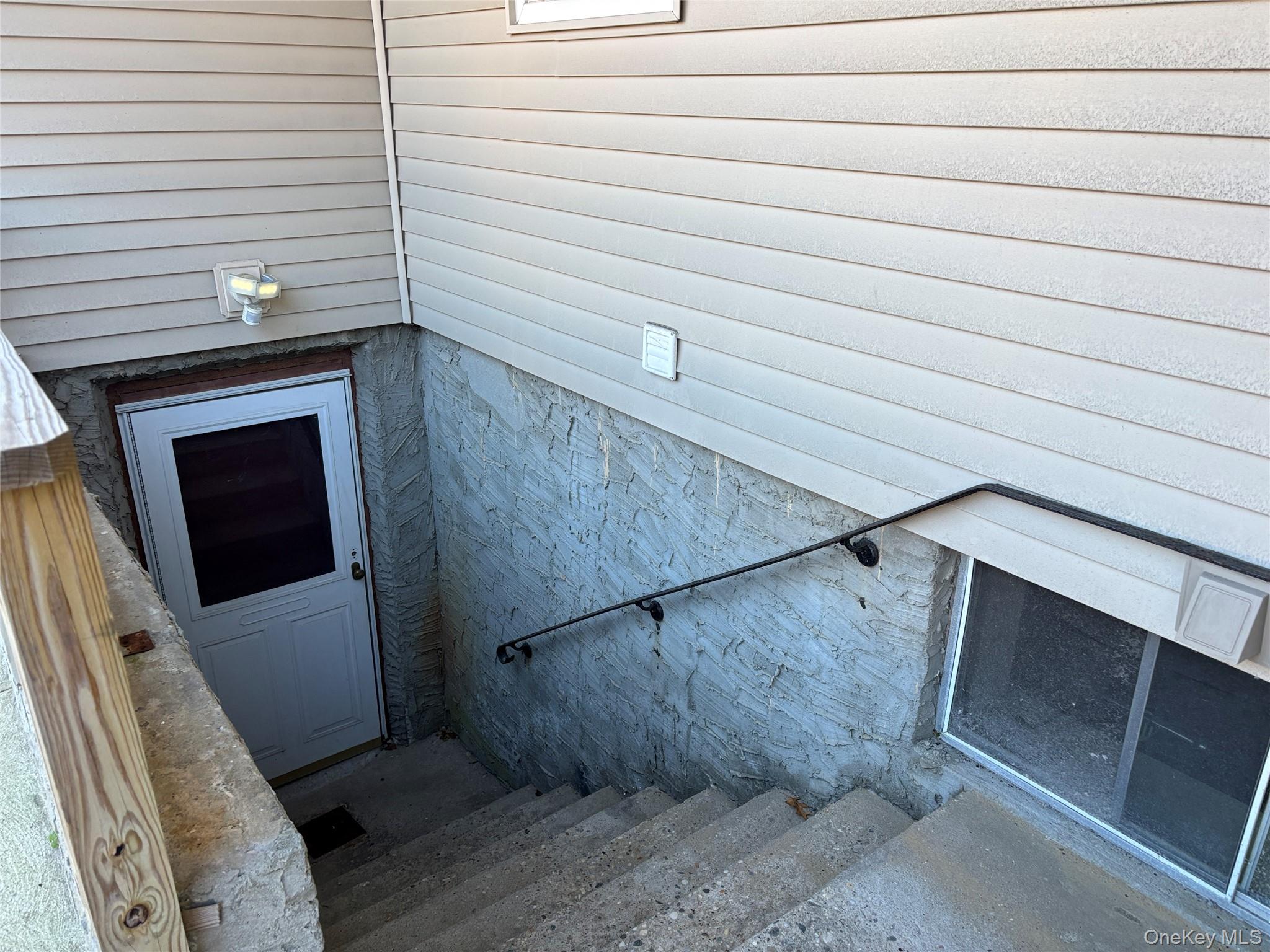 40 Canoe Place Road, Unit 4 Hampton Bays, NY 11946 - Photo 23 of 36 a view of a door and an outdoor space