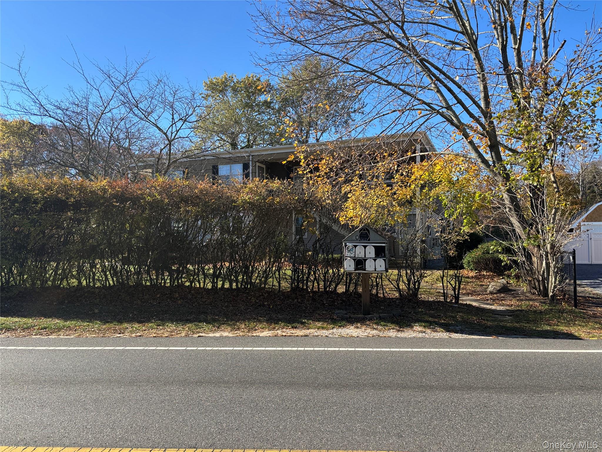 40 Canoe Place Road, Unit 4 Hampton Bays, NY 11946 - Photo 3 of 36 View of front facade