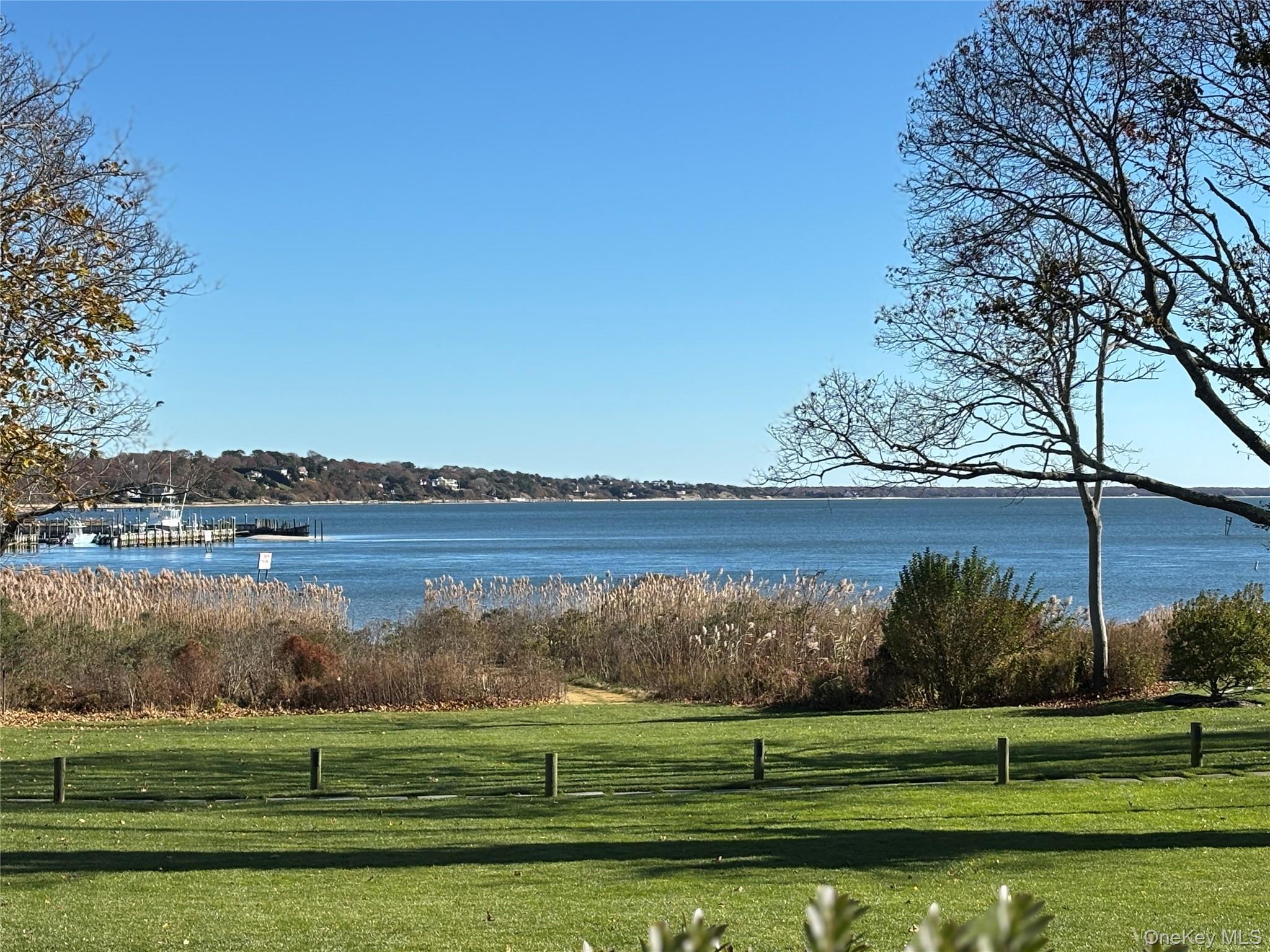 40 Canoe Place Road, Unit 4 Hampton Bays, NY 11946 - Photo 34 of 36 a view of a lake with a big yard