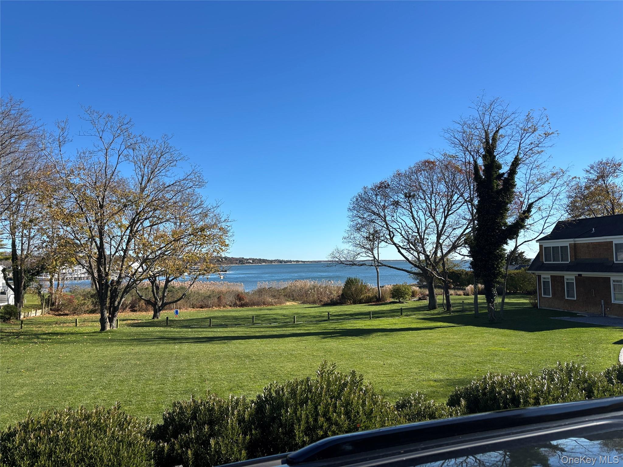 40 Canoe Place Road, Unit 4 Hampton Bays, NY 11946 - Photo 36 of 36 a view of a park with large trees