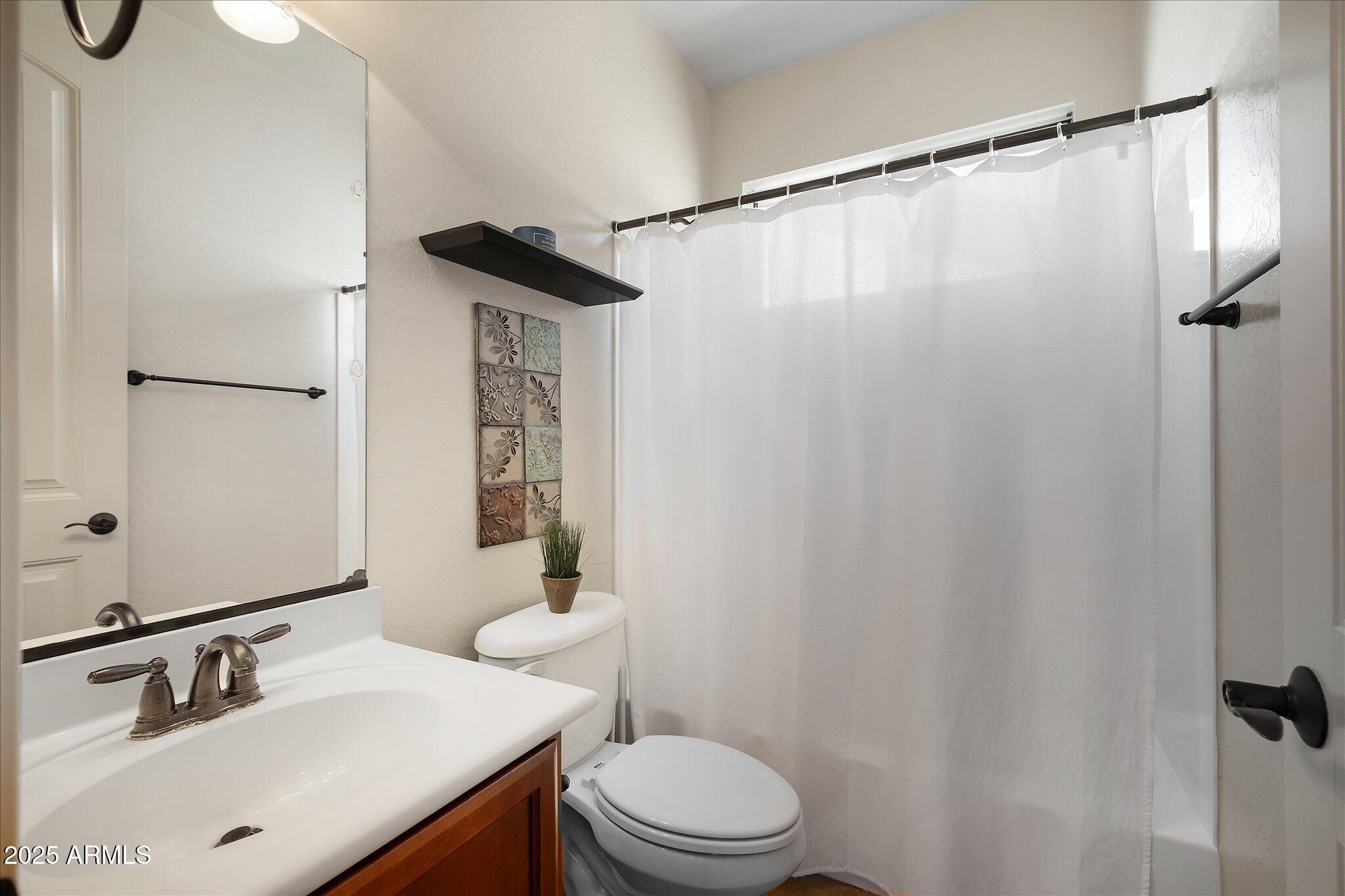 8536 East Inca Street Mesa, AZ 85207 - Photo 32 of 44 a bathroom with a sink and a mirror