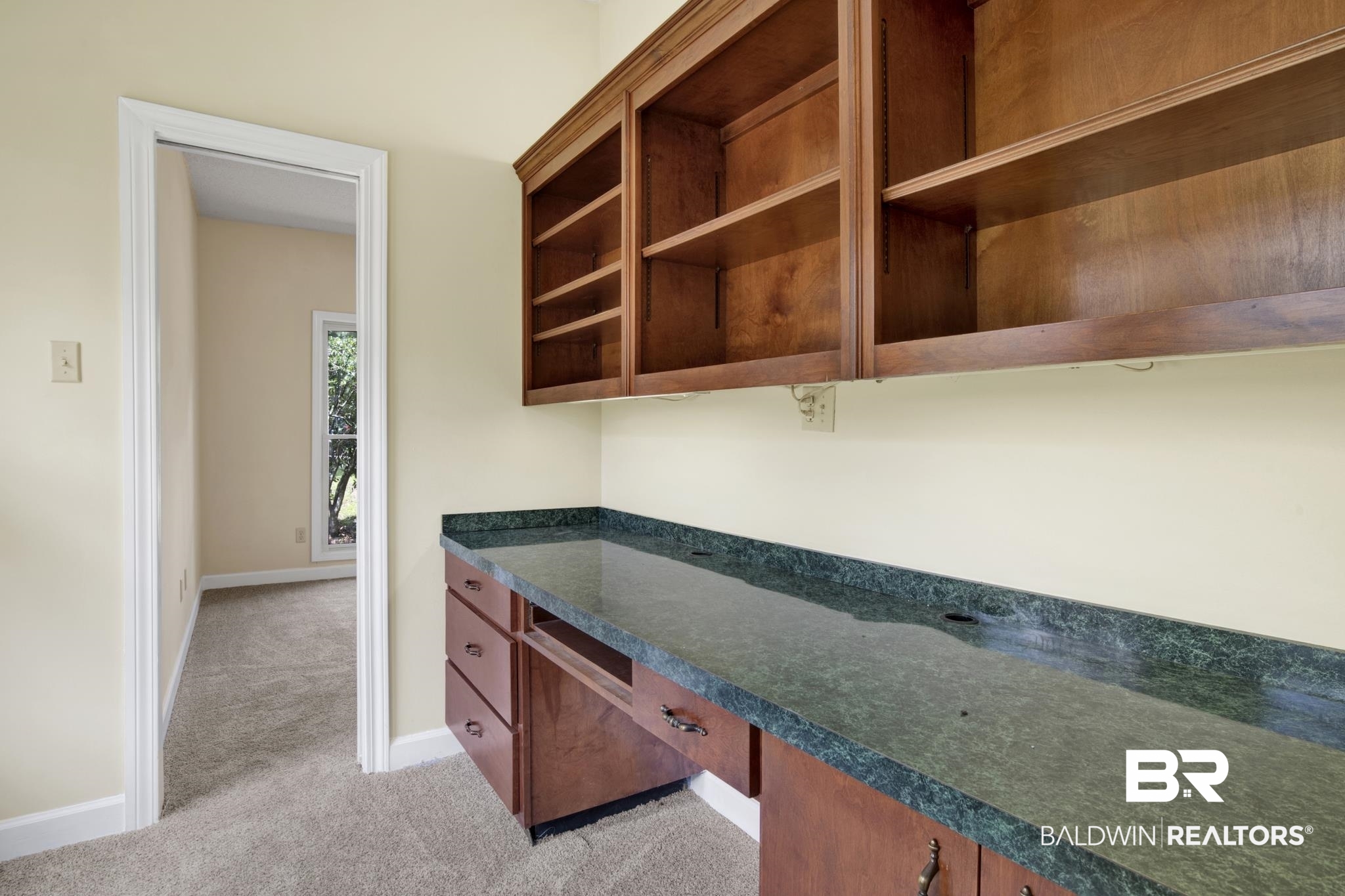 6805 Hunters Court Mobile, AL 36695 - Photo 31 of 37 Kitchen with light carpet, dark countertops, and baseboards