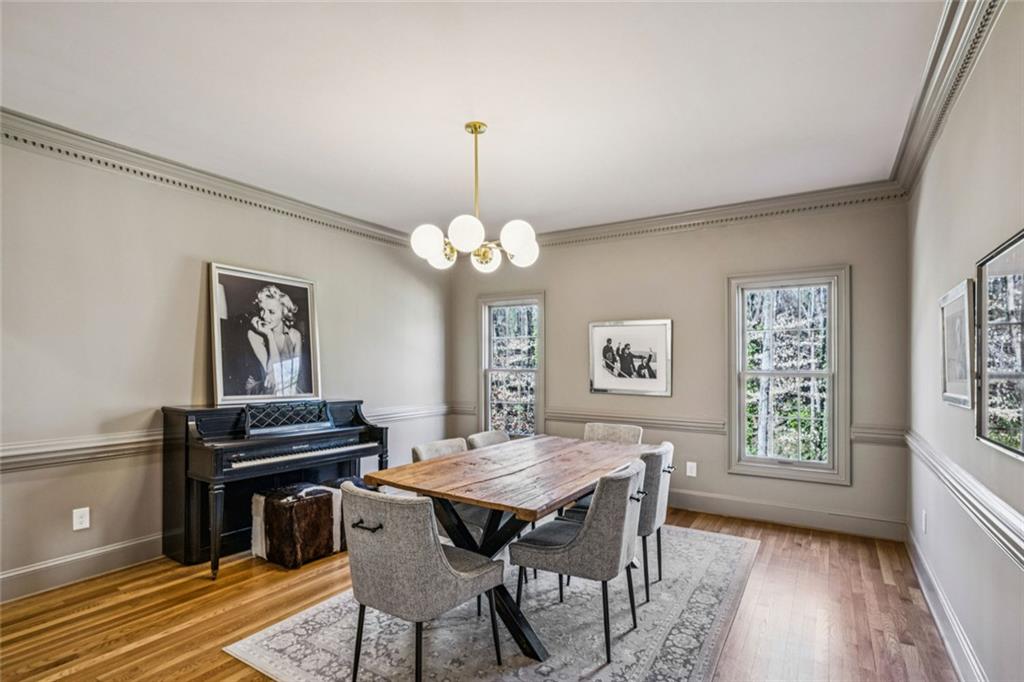 4575 Jett Road Atlanta, GA 30327 - Photo 14 of 42 a view of a dining room with furniture and wooden floor