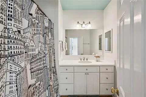 a bathroom with a double vanity sink mirror and