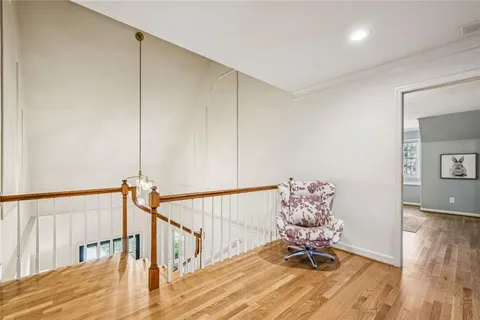 a living room with table and stairs