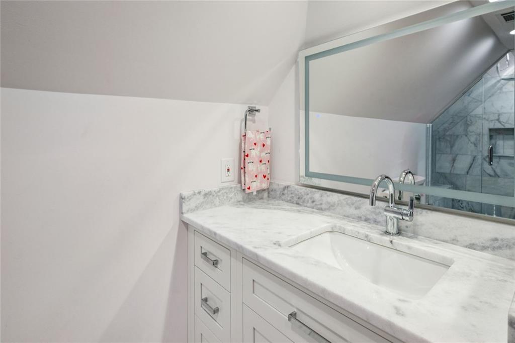4575 Jett Road Atlanta, GA 30327 - Photo 26 of 42 a bathroom with a sink and a mirror
